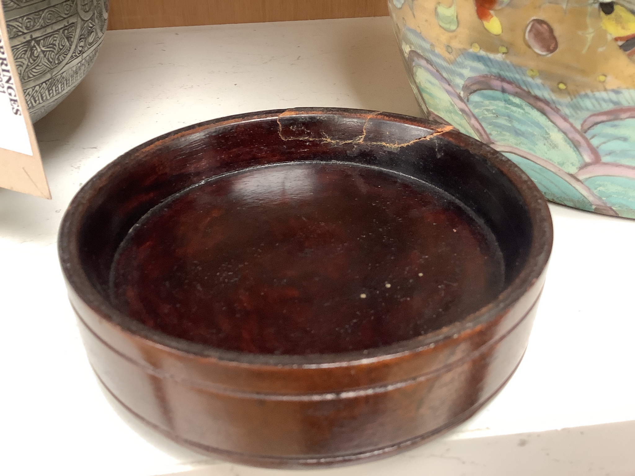 A 19th century Chinese clobbered jar with wood cover 24cm